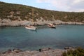 Traditional Turkish Gulet schooners moored at cove in calm waters.