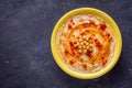 Traditional turkish hummus on a dark stone background