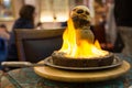 Tandir kebab in clay pot in flame