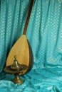 Traditional turkish lamps, national musical instrument baglama saz on a blue background. still life in turkish Royalty Free Stock Photo