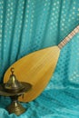 Traditional turkish lamps, national musical instrument baglama saz on a blue background. still life in turkish Royalty Free Stock Photo