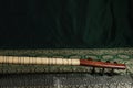 Traditional Turkish national musical instrument baglama saz on a dark green background. a magnificent century. The concept of