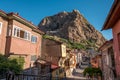 Traditional Turkish Ottoman houses in Afyonkarahisar Turkey. Afyon Castle on the rock and Mevlevihane Museum in front of it Royalty Free Stock Photo