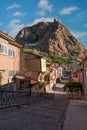 Traditional Turkish Ottoman houses in Afyonkarahisar Turkey. Afyon Castle on the rock and Mevlevihane Museum in front of it Royalty Free Stock Photo