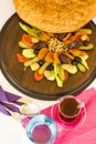 Traditional Turkish Ramadan Iftar Wooden Plate with Ramadan Bread and tea.