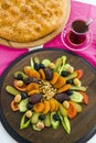 Traditional Turkish Ramadan Iftar Wooden Plate with Round Fresh Bread Royalty Free Stock Photo