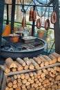 Traditional Turkish street food Kokoretsi also known as Kokorec and Sucuk meat sausage hanging on steel hooks above barbecue next