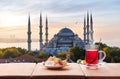 Traditional turkish tea in front of the Blue Mosque, Istanbul Royalty Free Stock Photo