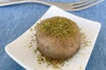 Traditional Turkish un halva dessert with pistachios