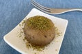 Traditional Turkish un halva dessert with pistachios
