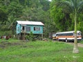 Traditional typical carribean house and old truck in Belize Royalty Free Stock Photo