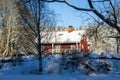 Traditional typical Scandinavian Swedish house or villa in the countryside in winter. Royalty Free Stock Photo