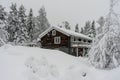 Traditional typical Scandinavian Swedish house or villa in the countryside in winter. Two floors old wooden house after snowfall. Royalty Free Stock Photo