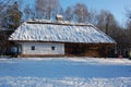 Traditional Ukrainian architecture. Old house with thatched roof and wooden church. Pirogovo museum, Kiev, Ukraine, Europe