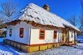 Traditional Ukrainian architecture. Old house with thatched roof and wooden church. Pirogovo museum, Kiev, Ukraine, Europe
