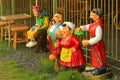 Traditional Ukrainian ceramic characters, in national costumes, for landscape decoration in shop dis