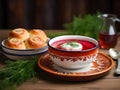 Traditional Ukrainian dish composed of a steaming bowl of beet soup, garnished with fresh dill and a dollop of sour cream on top