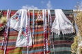 Traditional Ukrainian embroidery on a carpet and towels that hang on a fence in a village courtyard, Ukraine