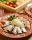 Traditional Ukrainian food herring fish, side view, horizontal. Served on a rustic wooden table