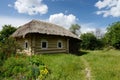 Traditional Ukrainian rural house with hay roof ,Pirogovo,Europe Royalty Free Stock Photo