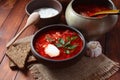 Traditional Ukrainian Russian borscht . Bowl of red beet root soup borsch with white cream Royalty Free Stock Photo