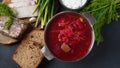 Traditional Ukrainian borscht . Bowl of red beet root soup borsch with white cream . Beet Root delicious soup . Royalty Free Stock Photo