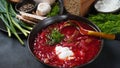 Traditional Ukrainian Russian borscht . Bowl of red beet root soup borsch with white cream . Royalty Free Stock Photo