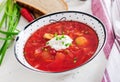 Traditional Ukrainian Russian borscht with white beans on the bowl.