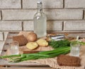 Traditional Ukrainian and Russian snacks outdoor. Food with alcohol. Vodka and smoked fish with bread, dill, jacket Royalty Free Stock Photo