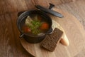 Traditional Ukrainian Russian soup, Borscht. Beetroot soup in bowl on wooden board and rustic wooden background Royalty Free Stock Photo