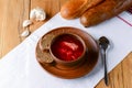 Traditional Ukrainian Russian soup, Borscht. Beetroot soup in bowl on wooden board and rustic wooden background Royalty Free Stock Photo