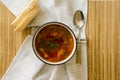 Traditional Ukrainian Russian vegetable soup borscht, with hard cream. parsley rye bread rolls Royalty Free Stock Photo