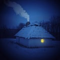 Traditional Ukrainian village in winter. Old house at Pirogovo ethnographic museum, Royalty Free Stock Photo