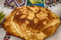 Traditional ukrainian wedding bread on an embroidery towel