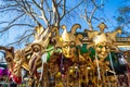 Traditional Venetian carnival masks displayed for sale on vendor stand Italy