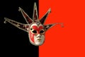 Traditional Venetian mask on a black and red background Royalty Free Stock Photo