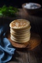 Traditional Venezuelan food arepa made from cornmeal, rustic style