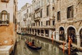 Traditional Venice Cityscape with narrow canal, gondola