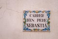 Traditional very beautiful old street name plate in Alicante, close up photo. ALICANTE, SPAIN - NOVEMBER 19, 2021