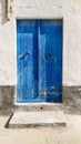 Traditional old painted door in a historical district or medina, Tunisia.