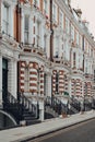 Traditional Victorian houses with stoops in Kensington, London, UK