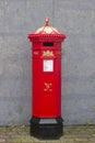 A traditional Victorian Royal Mail pillar box on the main road through the Royal Hillsborough Village Royalty Free Stock Photo