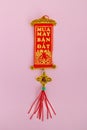 Traditional Vietnamese and Chinese New Year decoration red and golden colors on a pink background. Royalty Free Stock Photo