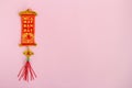 Traditional Vietnamese and Chinese New Year decoration red and golden colors on a pink background. Royalty Free Stock Photo