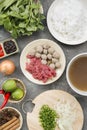 Traditional vietnamese noodle soups pho in bowls, concrete background. Vietnamese beef soup pho bo, Close-up. Asian/vietnamese Royalty Free Stock Photo