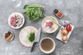 Traditional Vietnamese soup Pho bo with herbs, meat, rice noodles, broth. Pho bo in bowl with chopsticks, spoon. Space for text. T Royalty Free Stock Photo