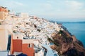 Traditional view of the island of Santorini at sunset with white, blue and orange buildings Royalty Free Stock Photo