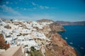 Traditional view of white houses and sea with boats on the island of Santorini Royalty Free Stock Photo