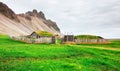 Traditional Viking village. Wooden houses near the mountain first settlements in Iceland.