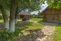 Traditional village house with blue sky, green grass, fence and trees. Ukraine. Traditional village house with blue sky, green Royalty Free Stock Photo